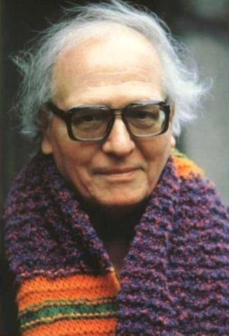 Photo of an old man wearing scarf and eyeglass.
